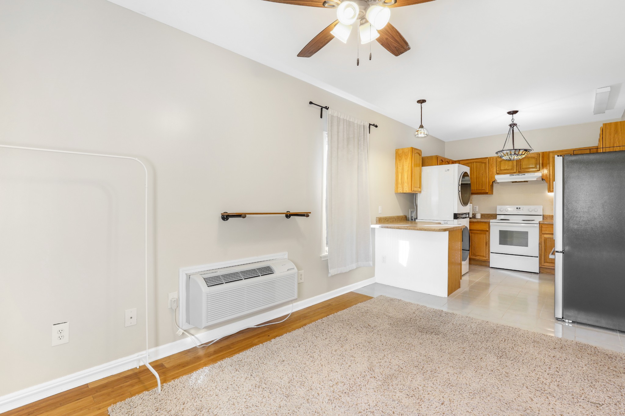 7518 Highway 49 Springfield, TN 37172 - Photo 27 of 35 a kitchen with stainless steel appliances a refrigerator and a chandelier