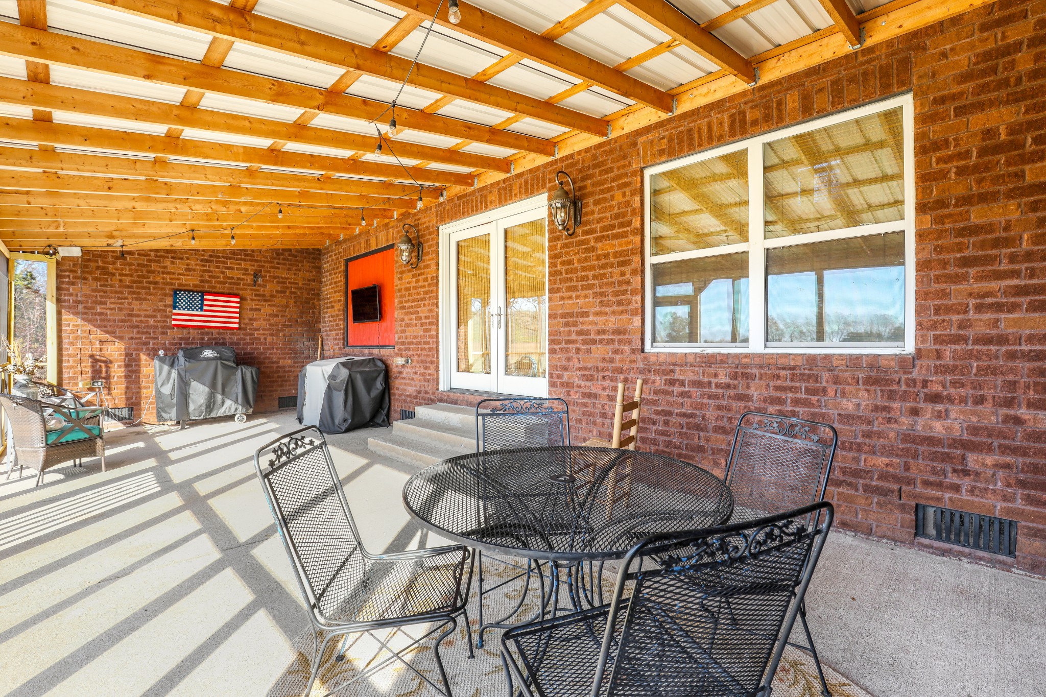 7518 Highway 49 Springfield, TN 37172 - Photo 32 of 35 a view of a patio with table and chairs and potted plants