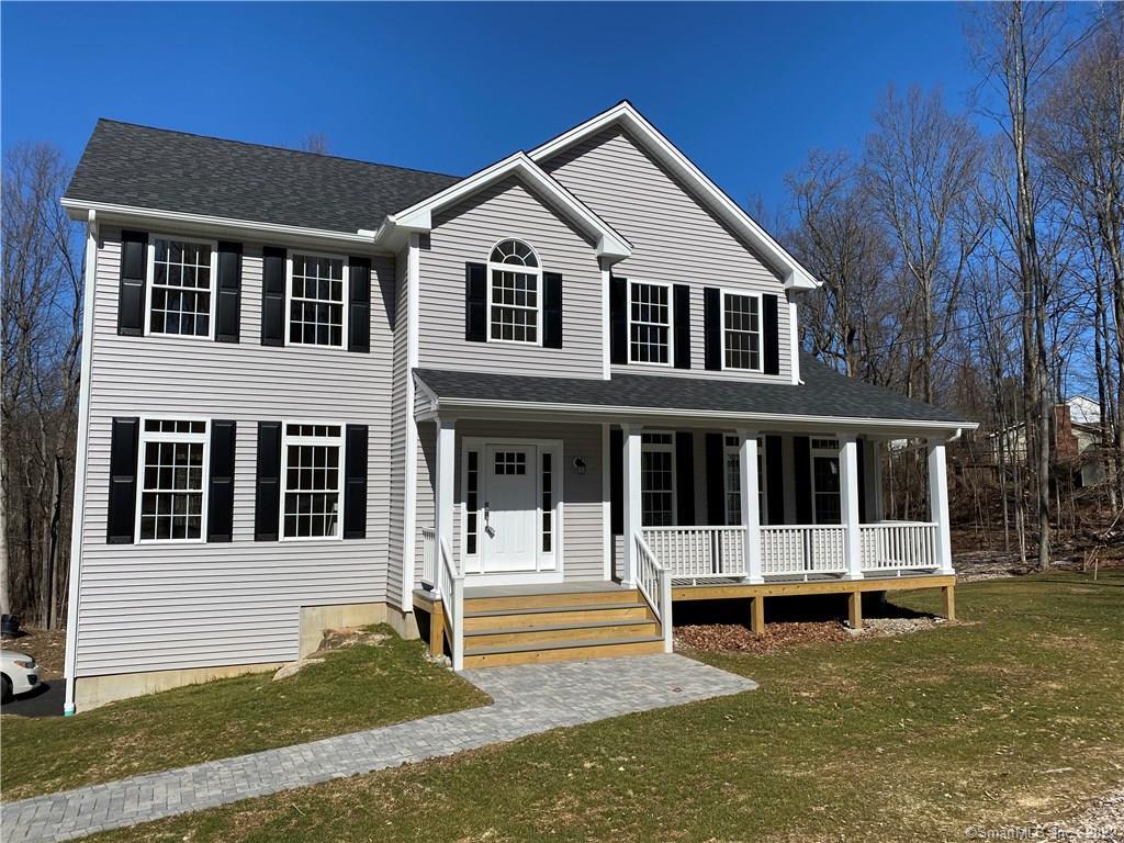 Farm House Colonial, Vinyl siding, paver walk way, architectural shingle roof, Trex decking, vinyl rail system.