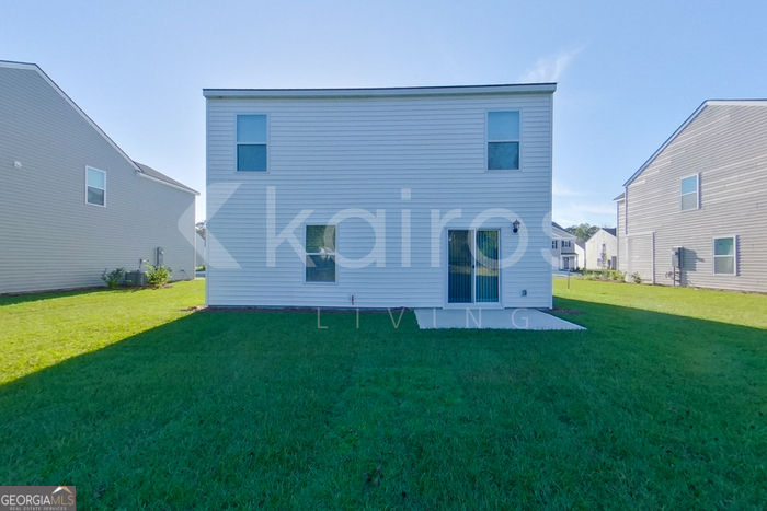 109 Inez Avenue Springfield, GA 31329 - Photo 22 of 26 a view of an house with backyard space and garden