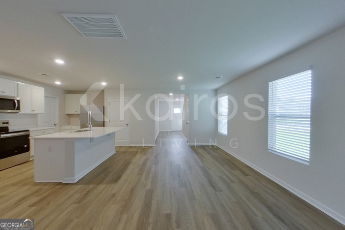 109 Inez Avenue Springfield, GA 31329 - Photo 3 of 26 a view of a kitchen with wooden floor and a sink