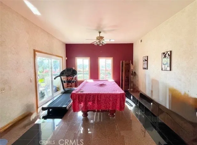 a bed room with a bed mirror and a window