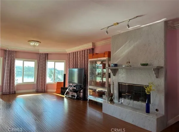 a view of a livingroom with furniture and a fireplace
