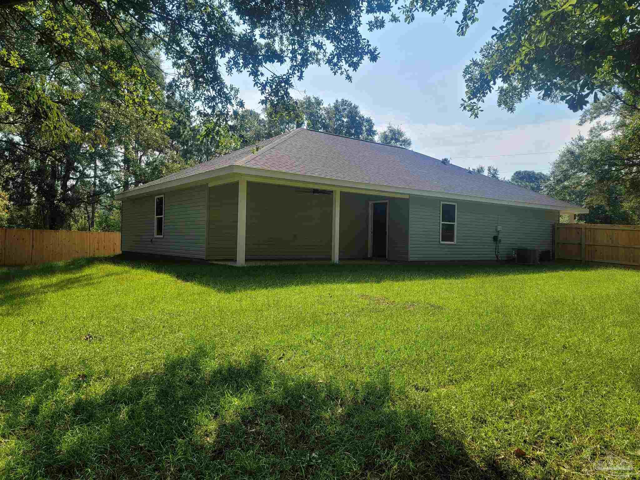 3030 Ferris Drive Navarre, FL 32566 - Photo 12 of 40 a view of a backyard