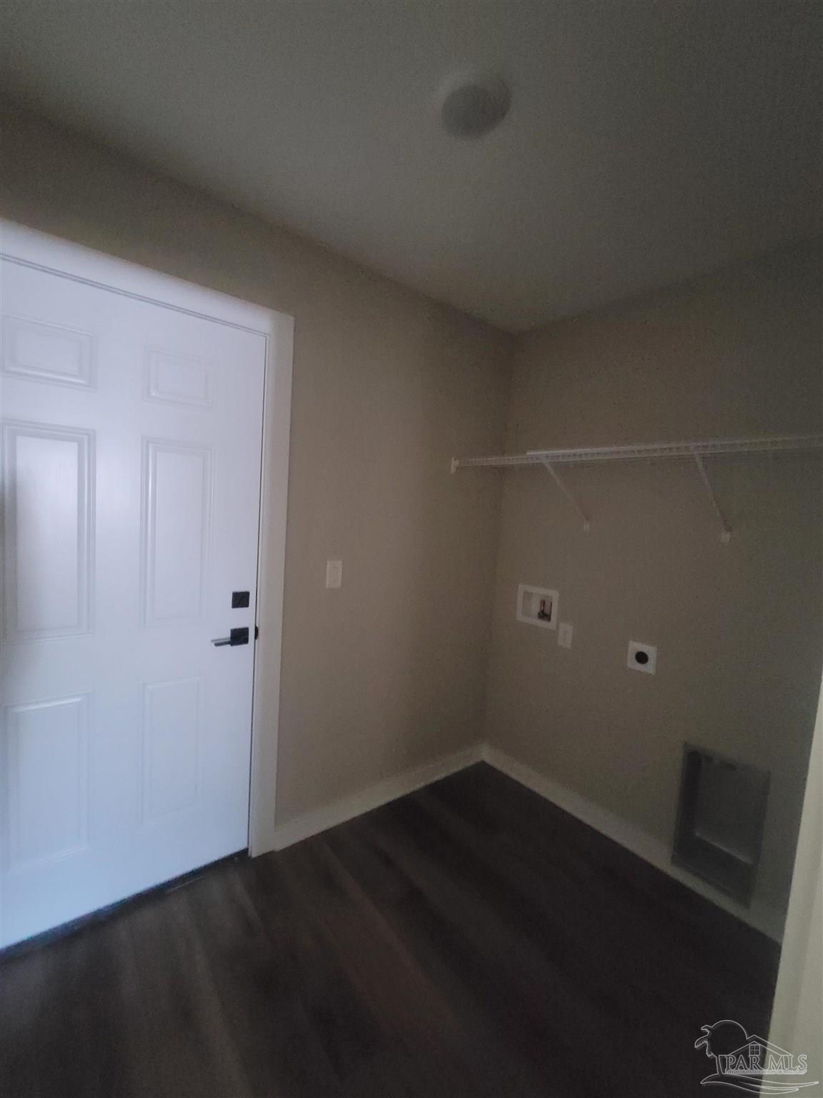 3030 Ferris Drive Navarre, FL 32566 - Photo 21 of 40 an empty room with wooden floor and windows