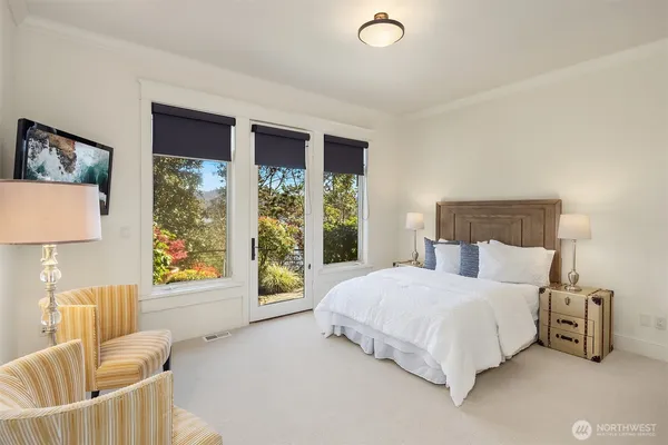 a bedroom with a bed a couch and dresser