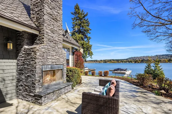 a terrace with outdoor seating and city view