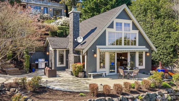 a view of a house with yard and sitting area