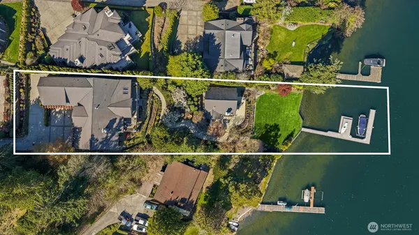 an aerial view of a house with outdoor space