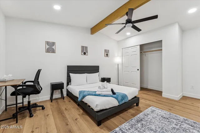 a bed room with a bed and a window