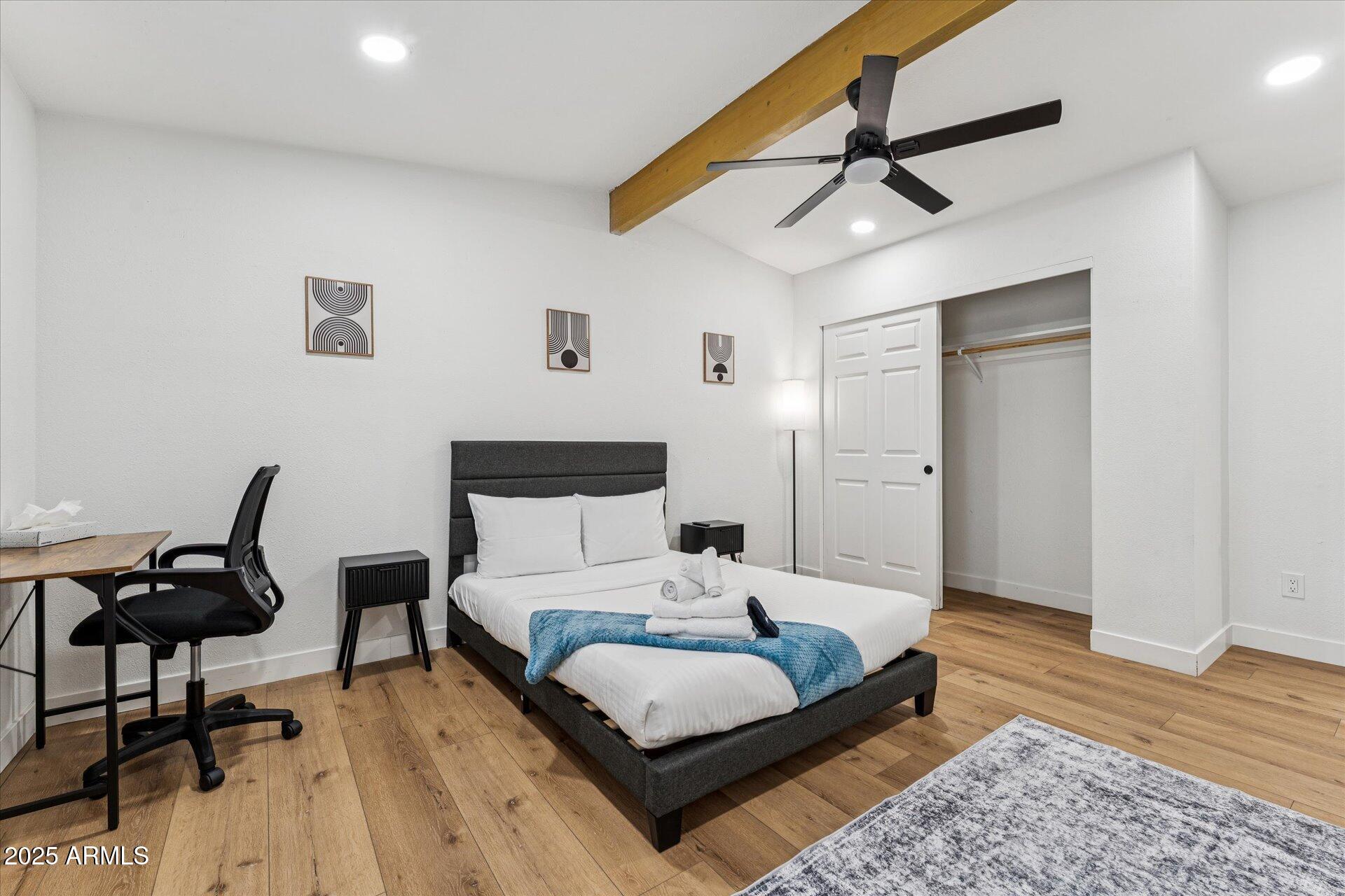 1548 North Upland Circle, Unit B Mesa, AZ 85201 - Photo 12 of 18 a bedroom with a bed and a mirror