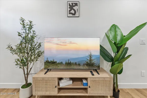 a view of livingroom with furniture and wooden floor