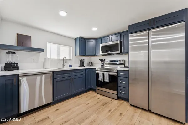 a kitchen with a stove and microwave