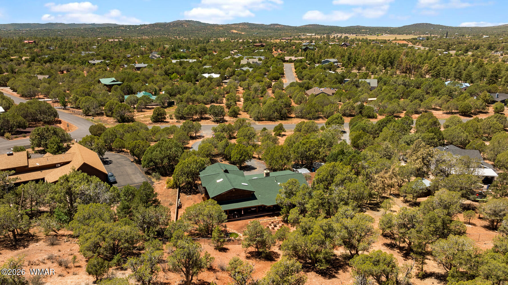 6720 Cheney Ranch Loop Show Low, AZ 85901 - Photo 55 of 55 an aerial view of residential house with parking space and mountain view in back