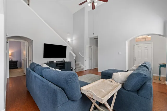 a living room with furniture and a flat screen tv