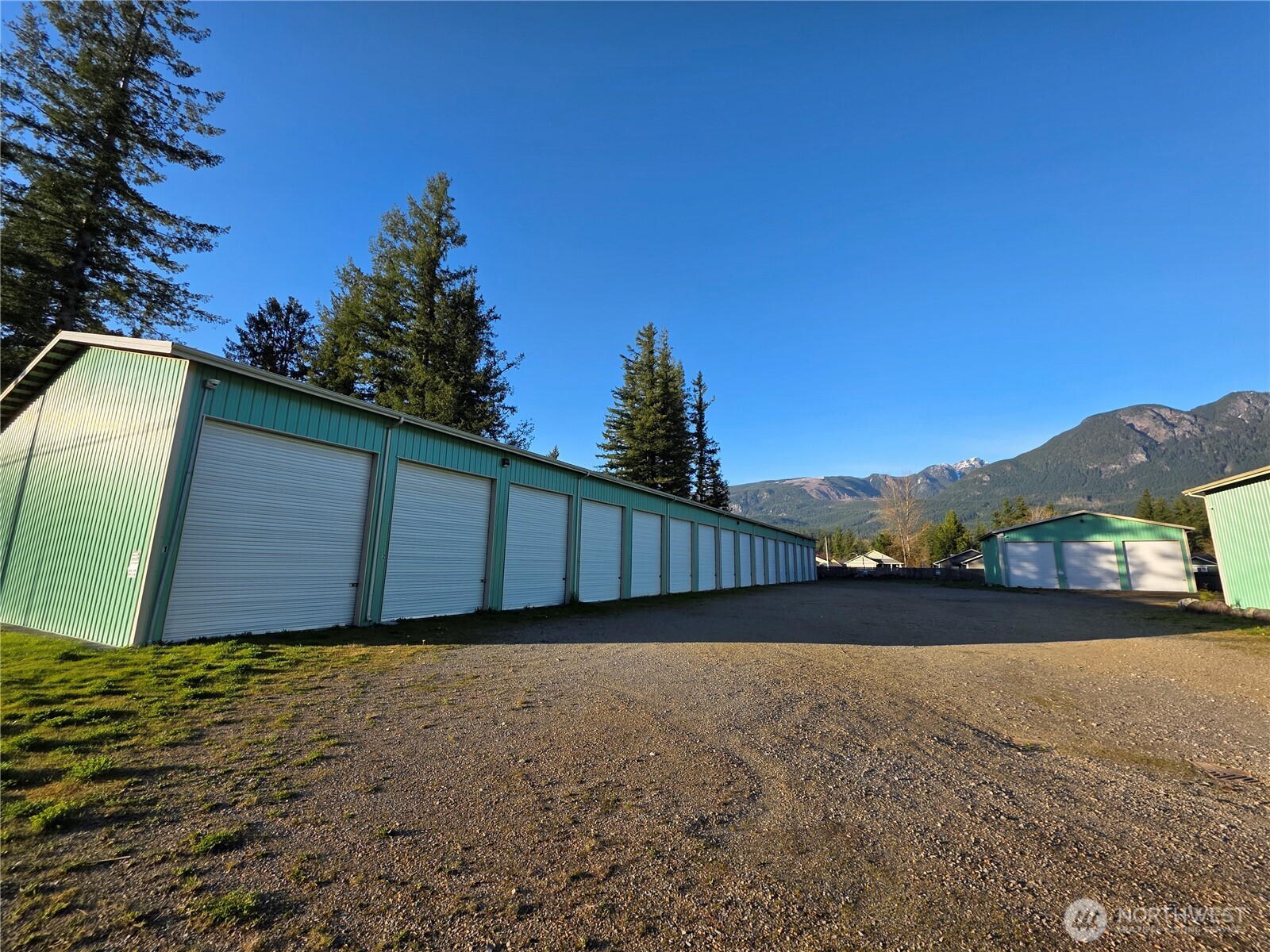 40807 Highway 2, Unit A8 Gold Bar, WA 98251 - Photo 1 of 19 a view of backyard with wooden fence