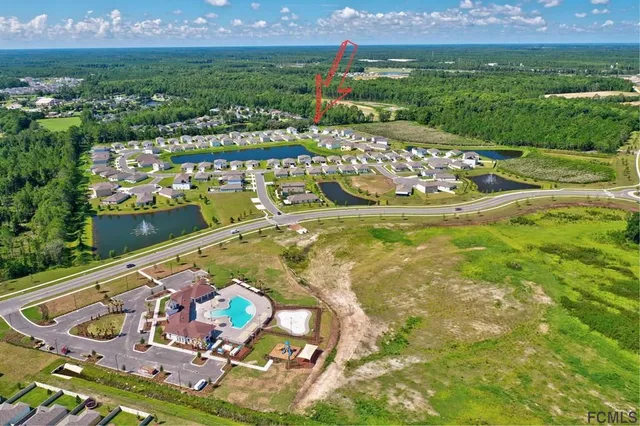 an aerial view of a house with outdoor space