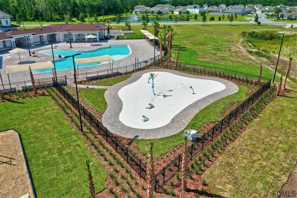a kitchen with a sink stainless steel appliances and white cabinets