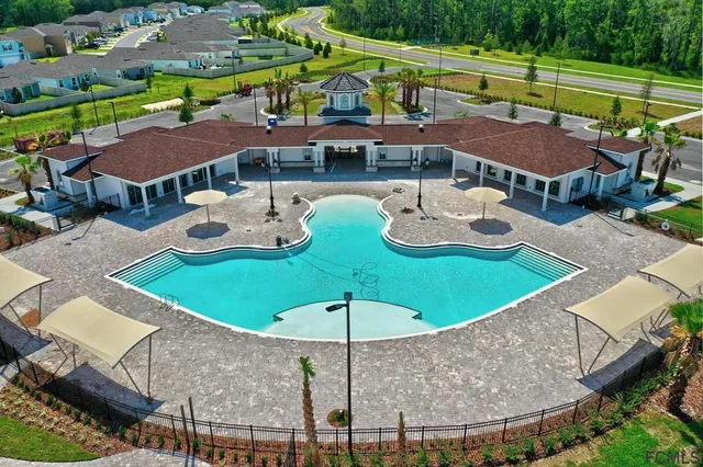 a kitchen with a stove a sink and a microwave