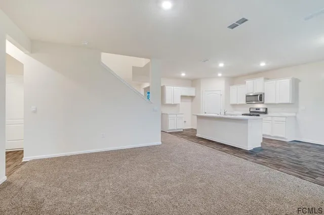 a view of a room that has a window in it