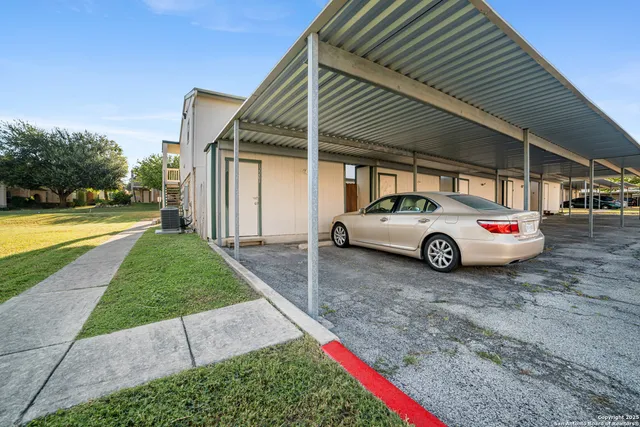 a view of a car parked in front of a house