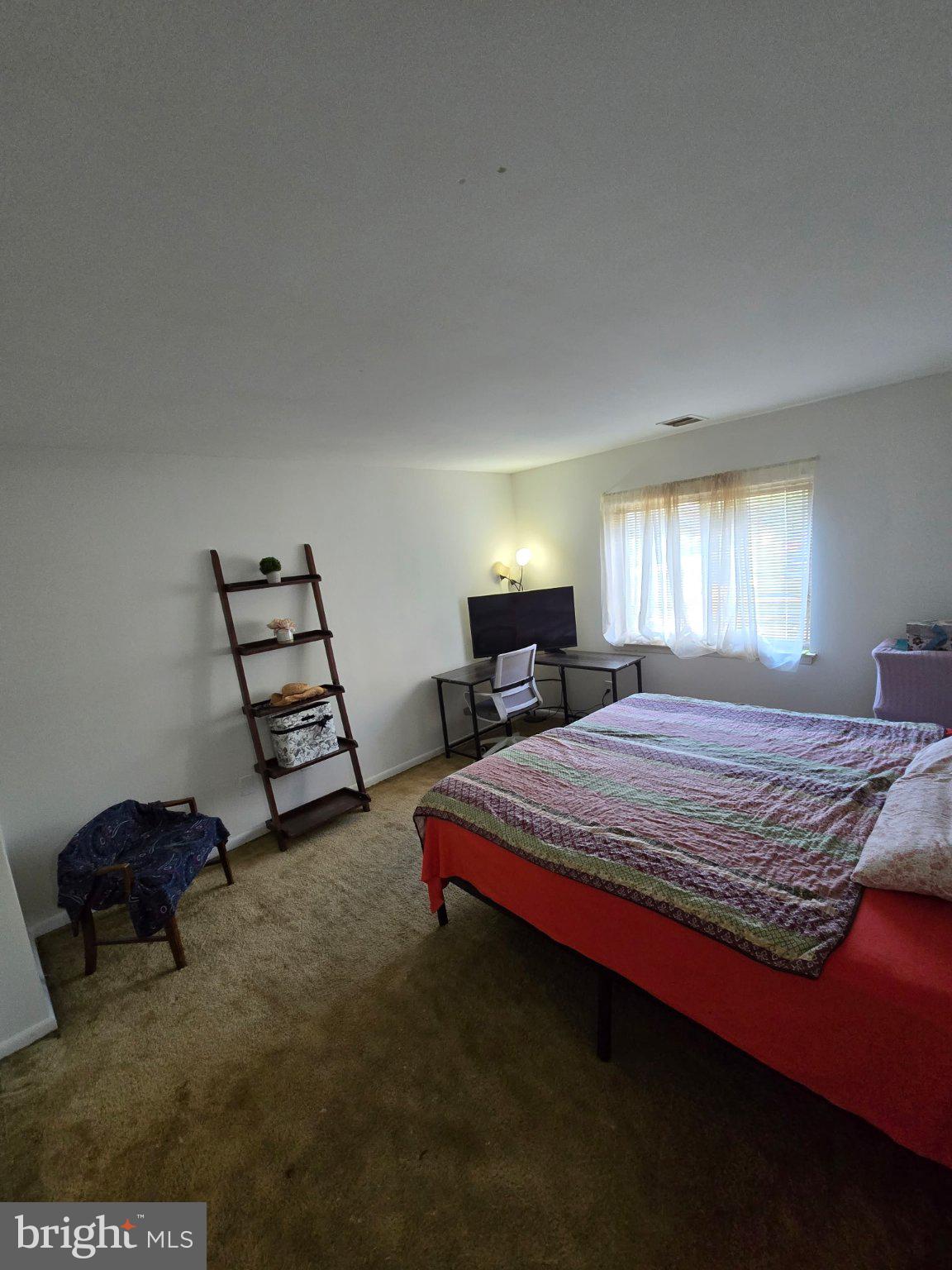 3384 Hewitt Avenue, Unit 201 Silver Spring, MD 20906 - Photo 10 of 10 a bedroom with a bed and window