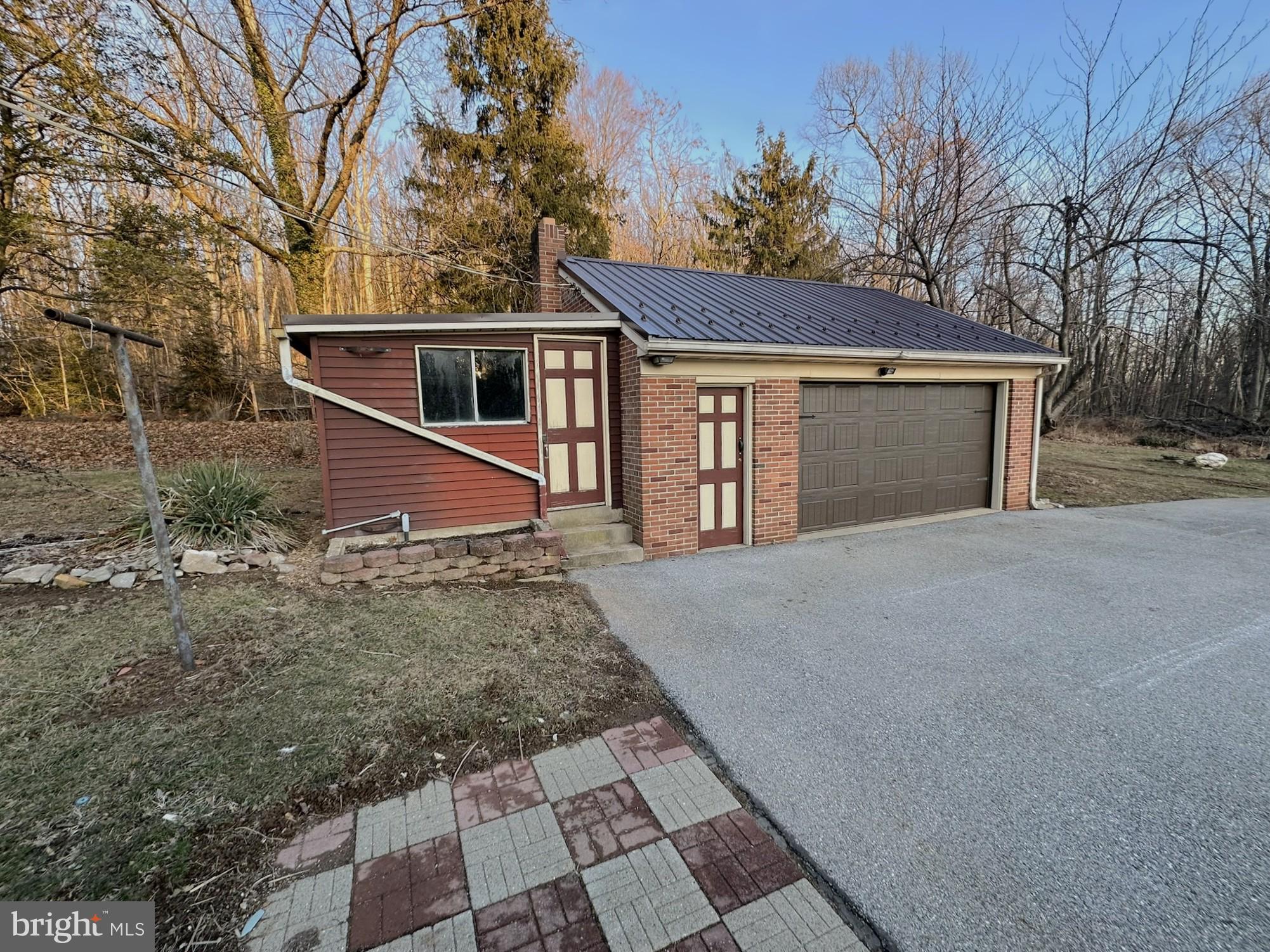 6355 Pigeon Hill Road Spring Grove, PA 17362 - Photo 45 of 55 a front view of a house with a yard and garage