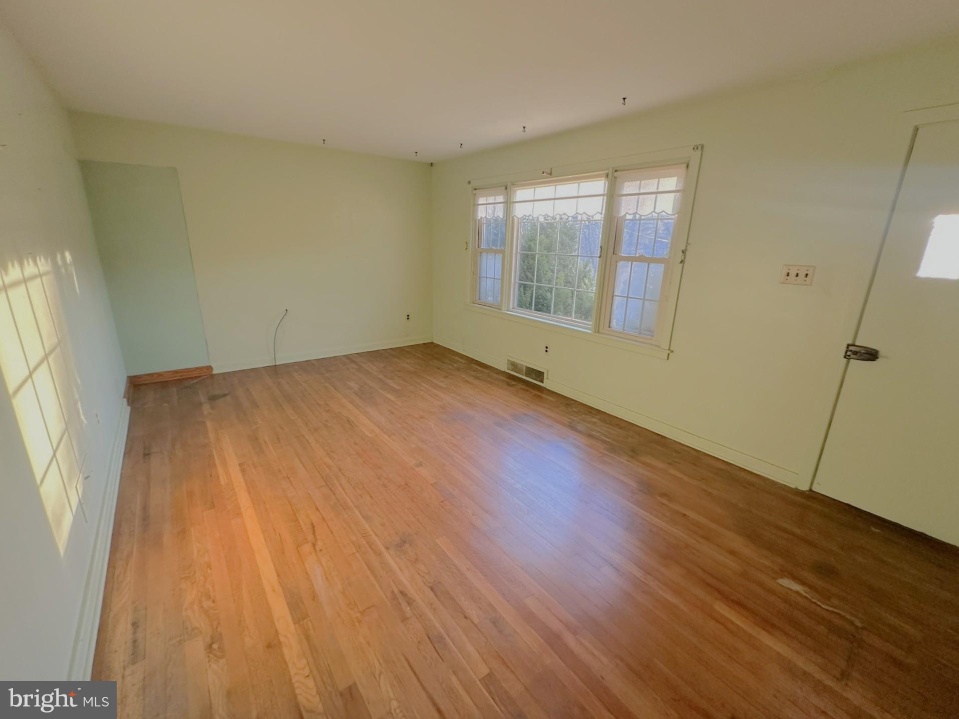 6355 Pigeon Hill Road Spring Grove, PA 17362 - Photo 7 of 55 an empty room with wooden floor and windows