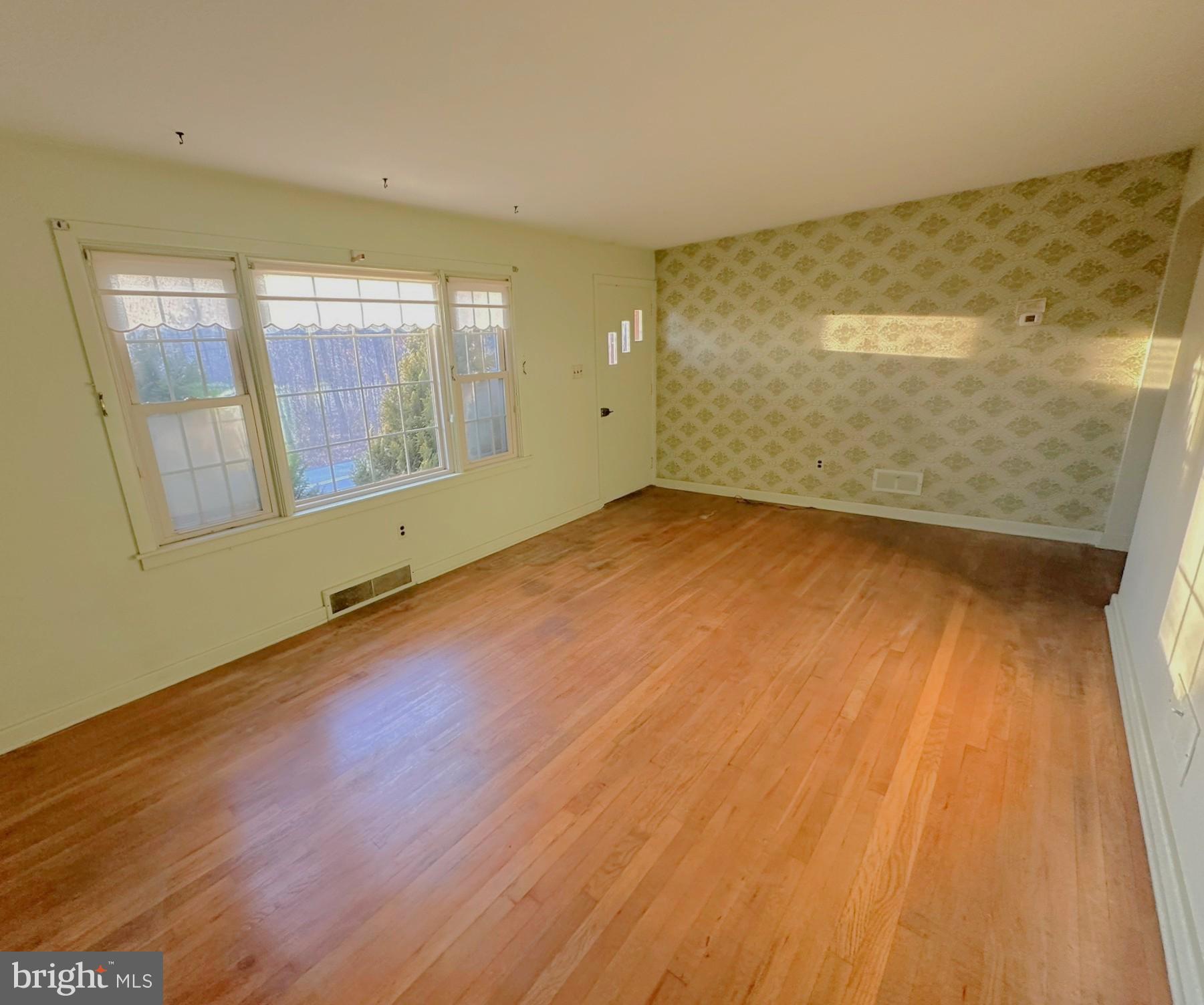 6355 Pigeon Hill Road Spring Grove, PA 17362 - Photo 8 of 55 an empty room with wooden floor and windows