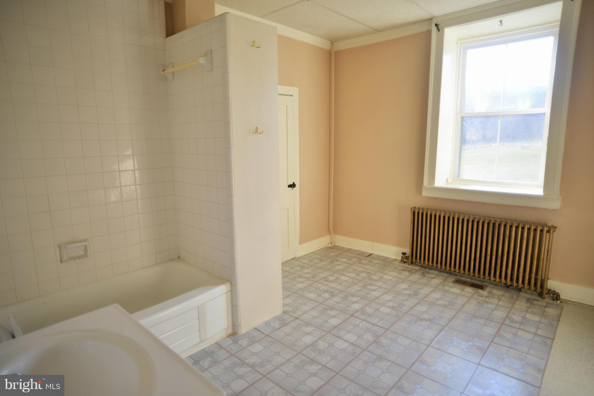 2203 Marker Road Middletown, MD 21769 - Photo 12 of 21 a bathroom with a sink toilet and shower