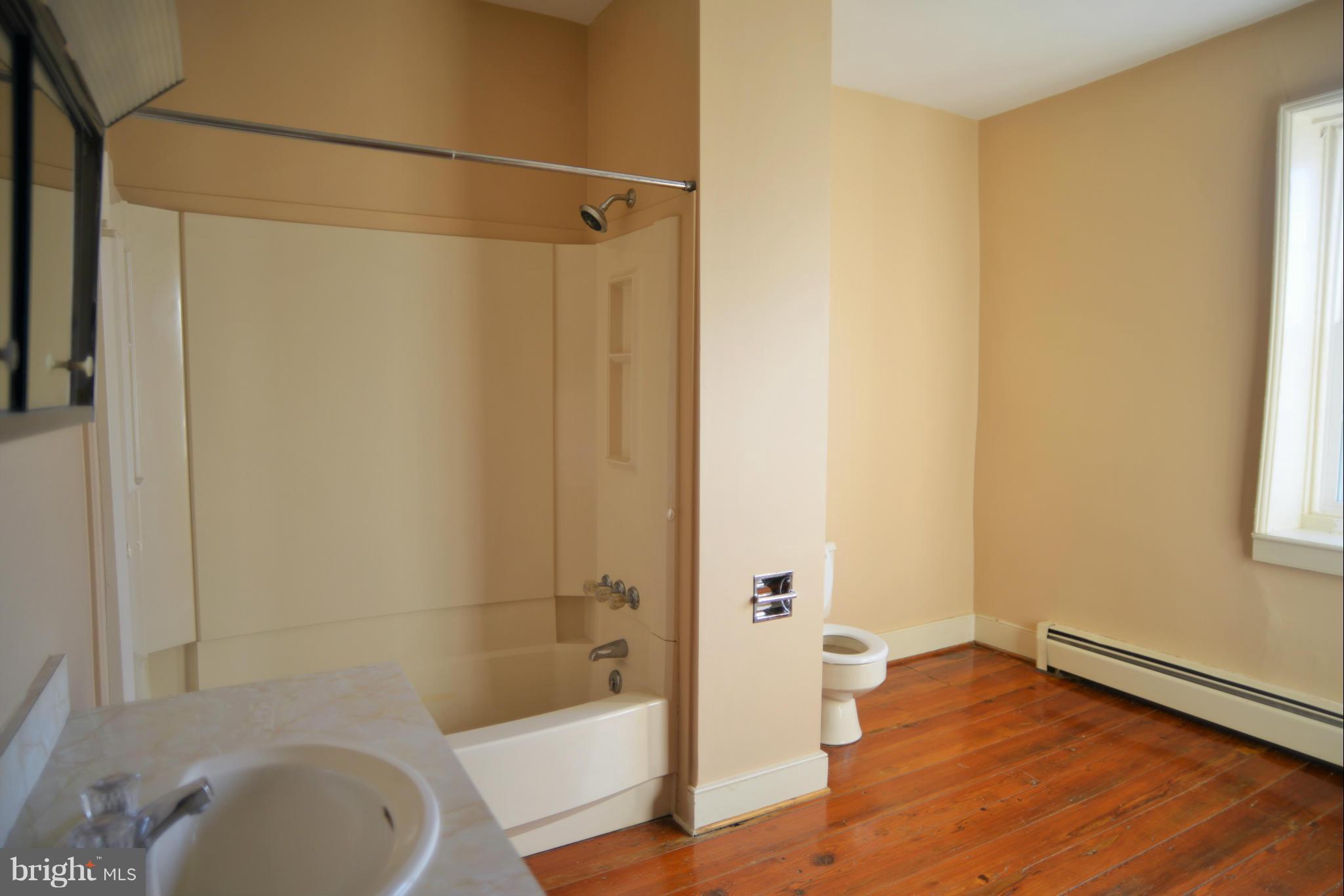 2203 Marker Road Middletown, MD 21769 - Photo 14 of 21 a bathroom with a sink a toilet and shower