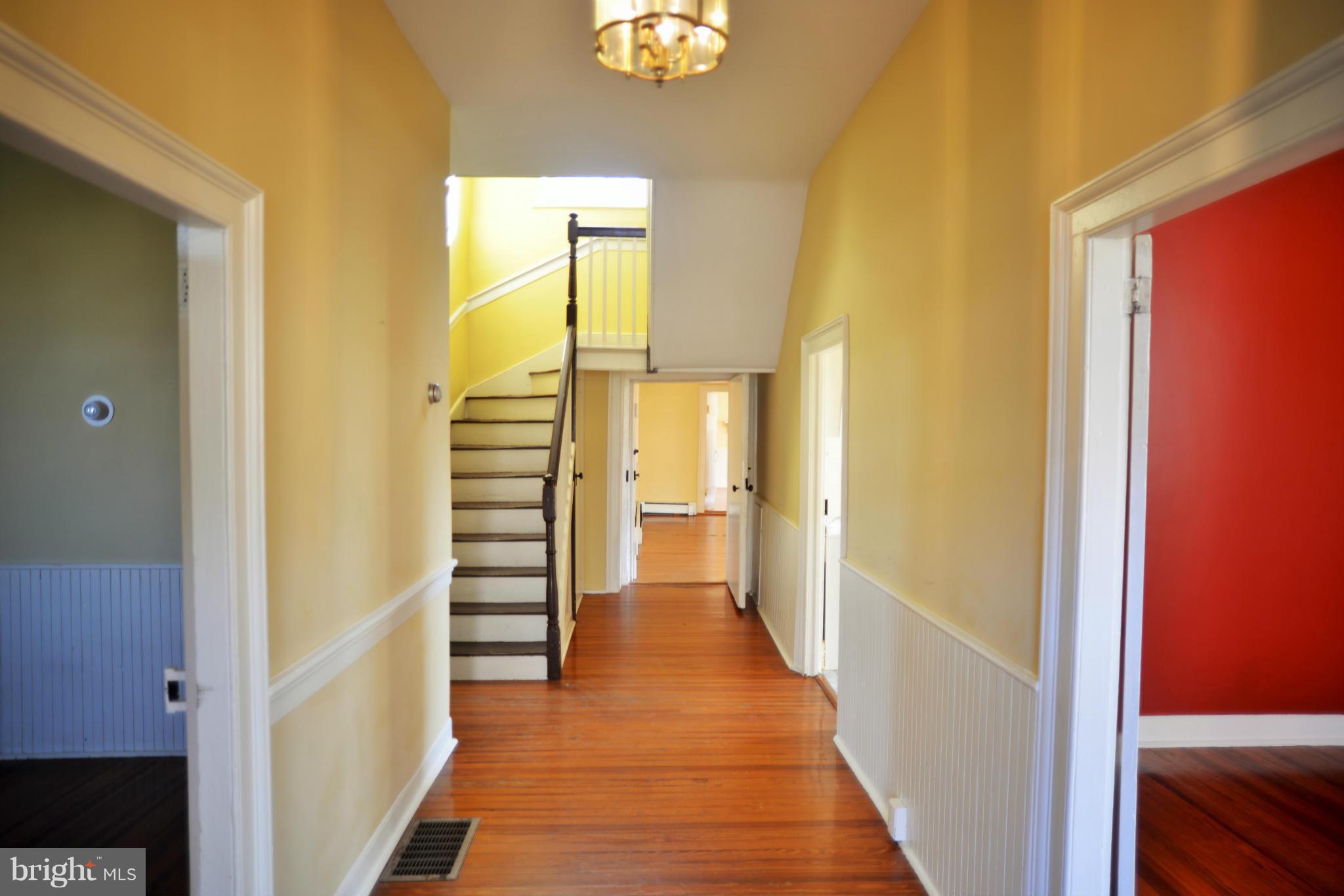 2203 Marker Road Middletown, MD 21769 - Photo 5 of 21 a view of a hallway with wooden floor and staircase