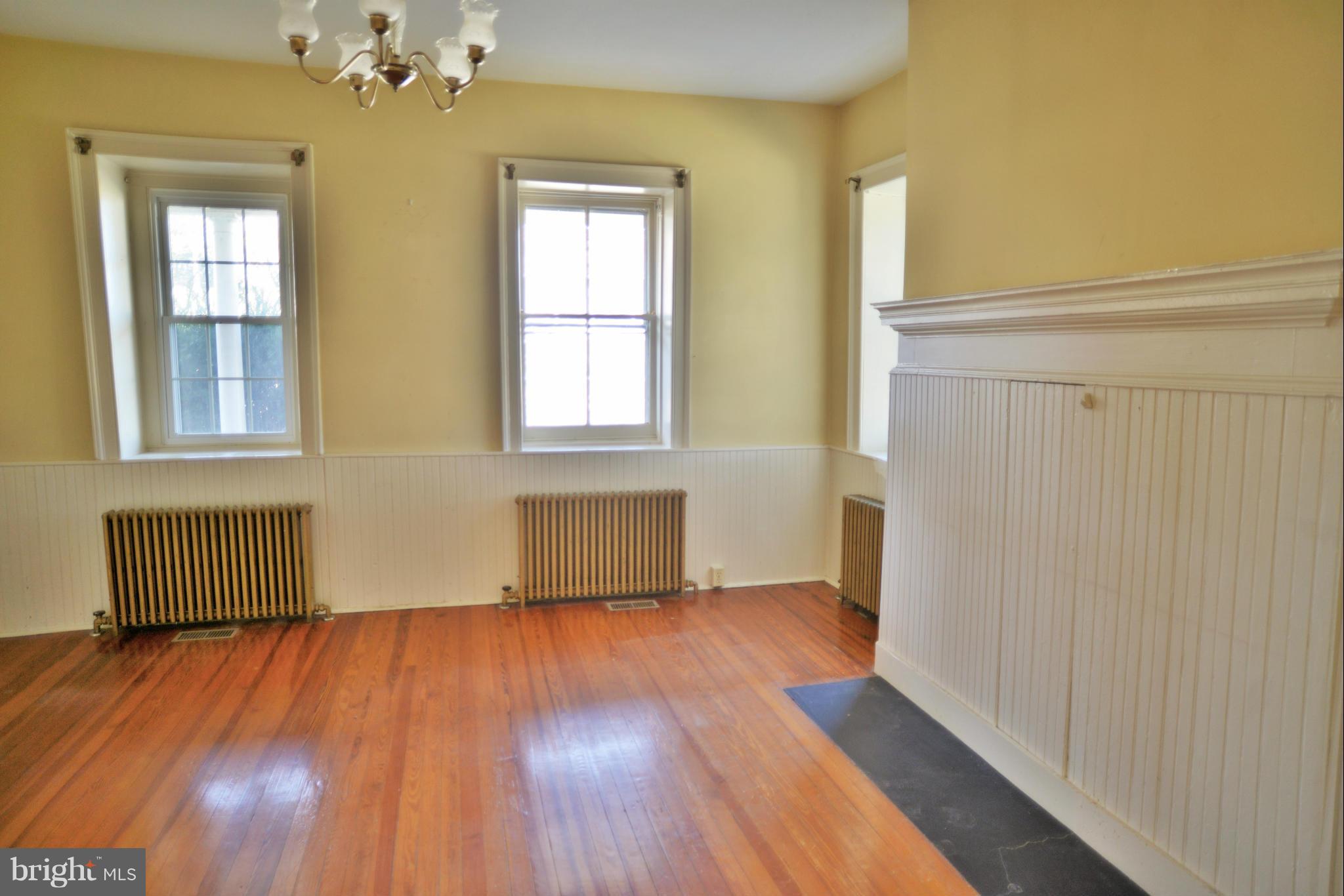 2203 Marker Road Middletown, MD 21769 - Photo 7 of 21 a view of an empty room with wooden floor and a window