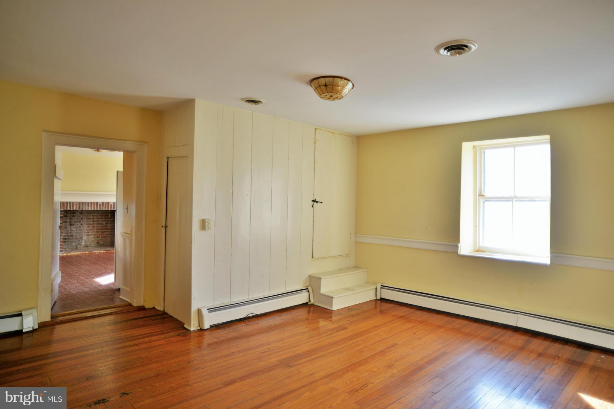 2203 Marker Road Middletown, MD 21769 - Photo 8 of 21 an empty room with wooden floor and windows