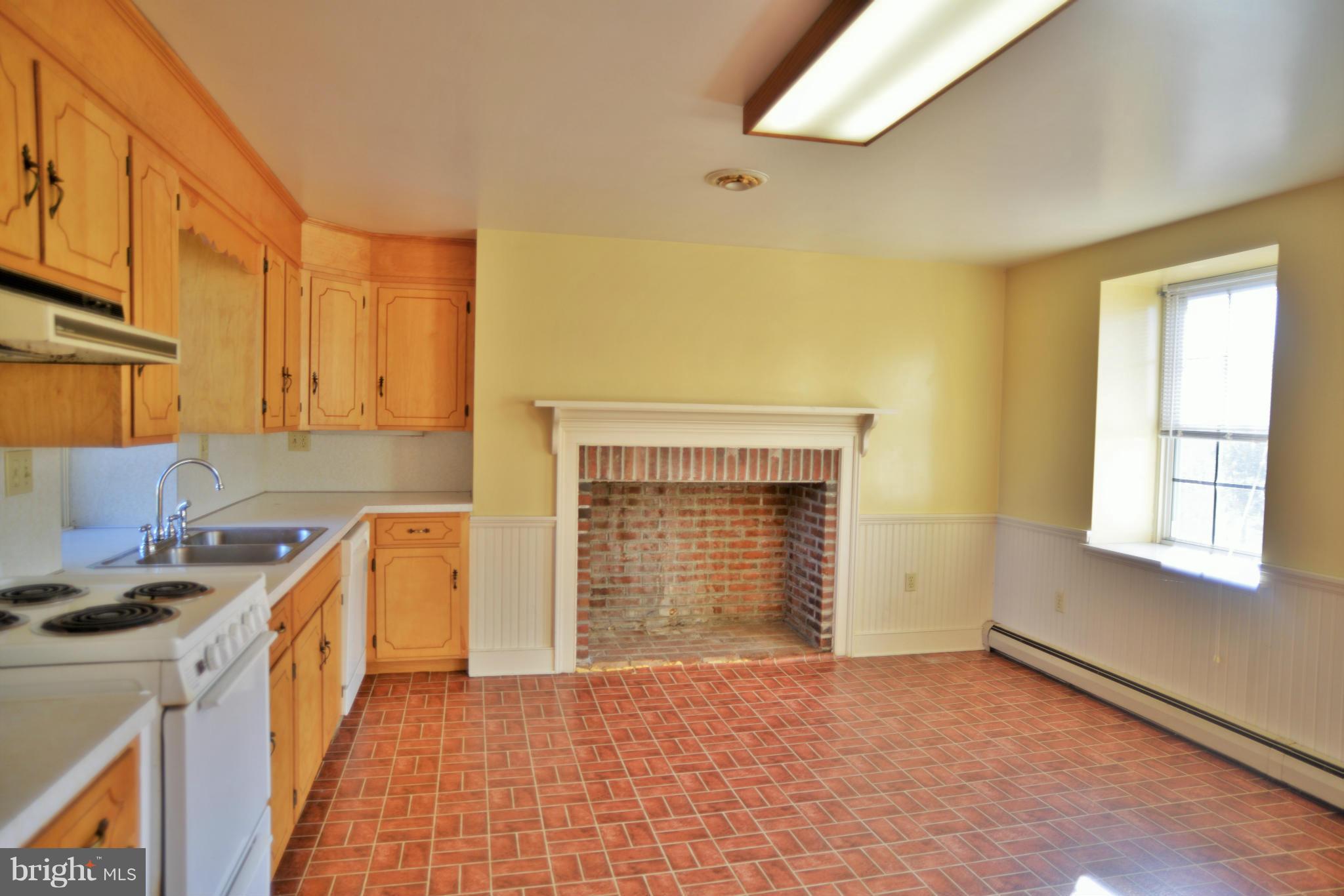 2203 Marker Road Middletown, MD 21769 - Photo 9 of 21 a kitchen with a sink stove and cabinets