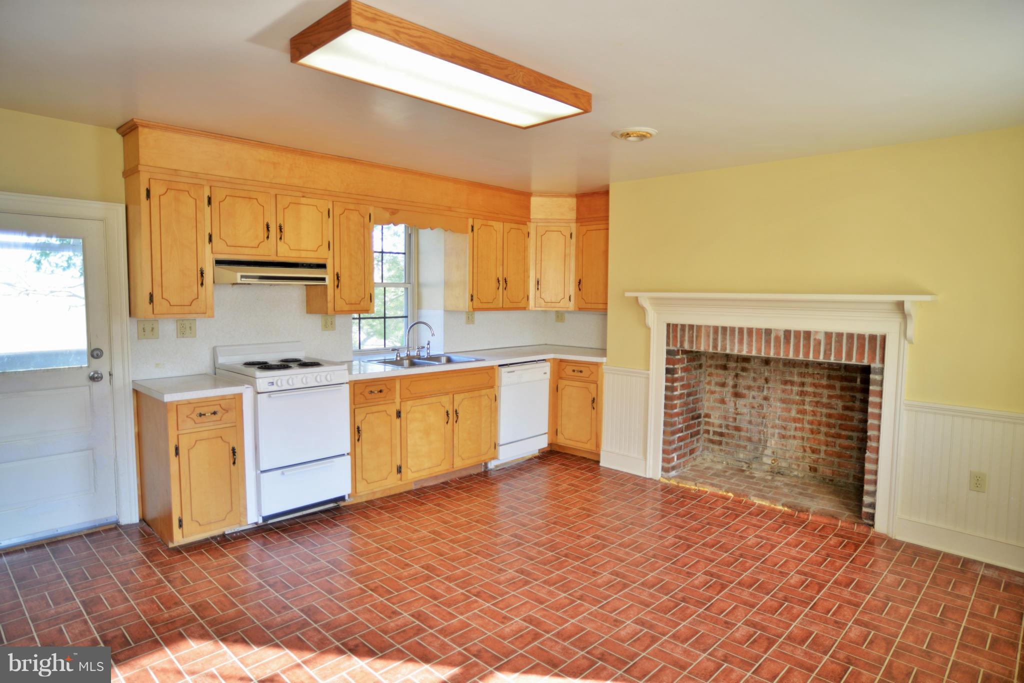 2203 Marker Road Middletown, MD 21769 - Photo 10 of 21 a kitchen with a stove a sink and a refrigerator