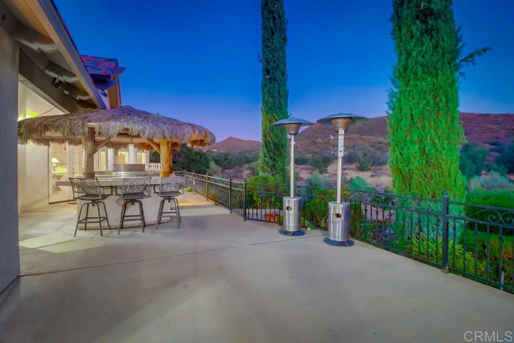 2576 Via Dieguenos Alpine, CA 91901 - Photo 34 of 41 a view of a patio with a table and chairs under an umbrella