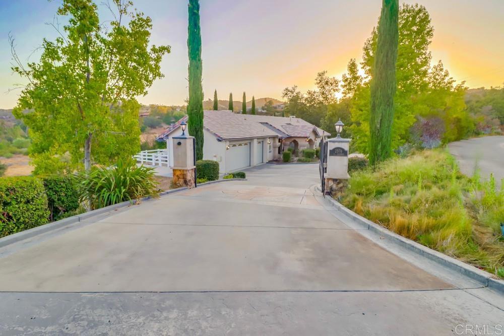 2576 Via Dieguenos Alpine, CA 91901 - Photo 36 of 41 a front view of a house with a yard and garage