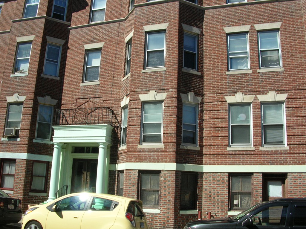 6 Lothian Road Boston, MA 02135 - Photo 2 of 7 a view of a brick building with many windows