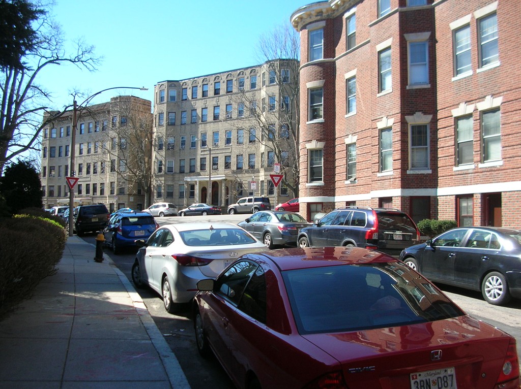 6 Lothian Road Boston, MA 02135 - Photo 3 of 7 a street view with couple of cars parked in front of buildings