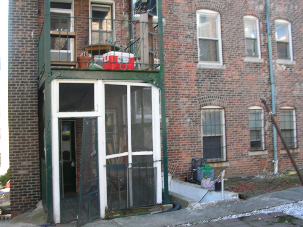 6 Lothian Road Boston, MA 02135 - Photo 6 of 7 a front view of multi story residential apartment building with retail shops
