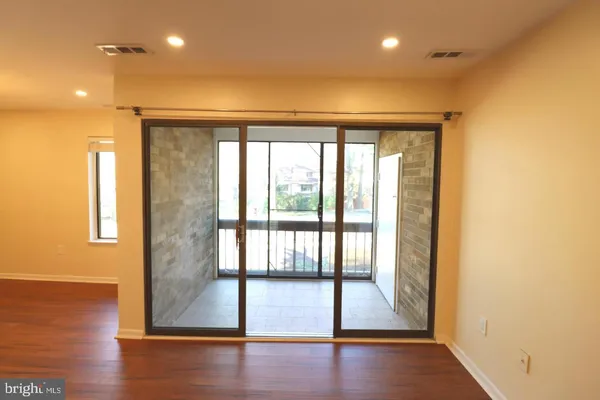 a view of entryway with wooden floor