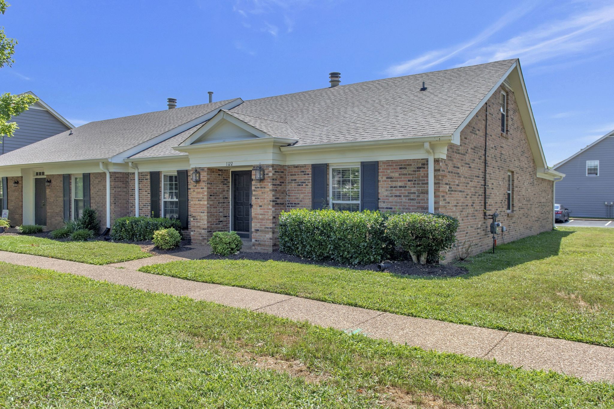 1122 General George Patton Road Nashville, TN 37221 - Photo 2 of 32 a view of a house next to a big yard and large trees