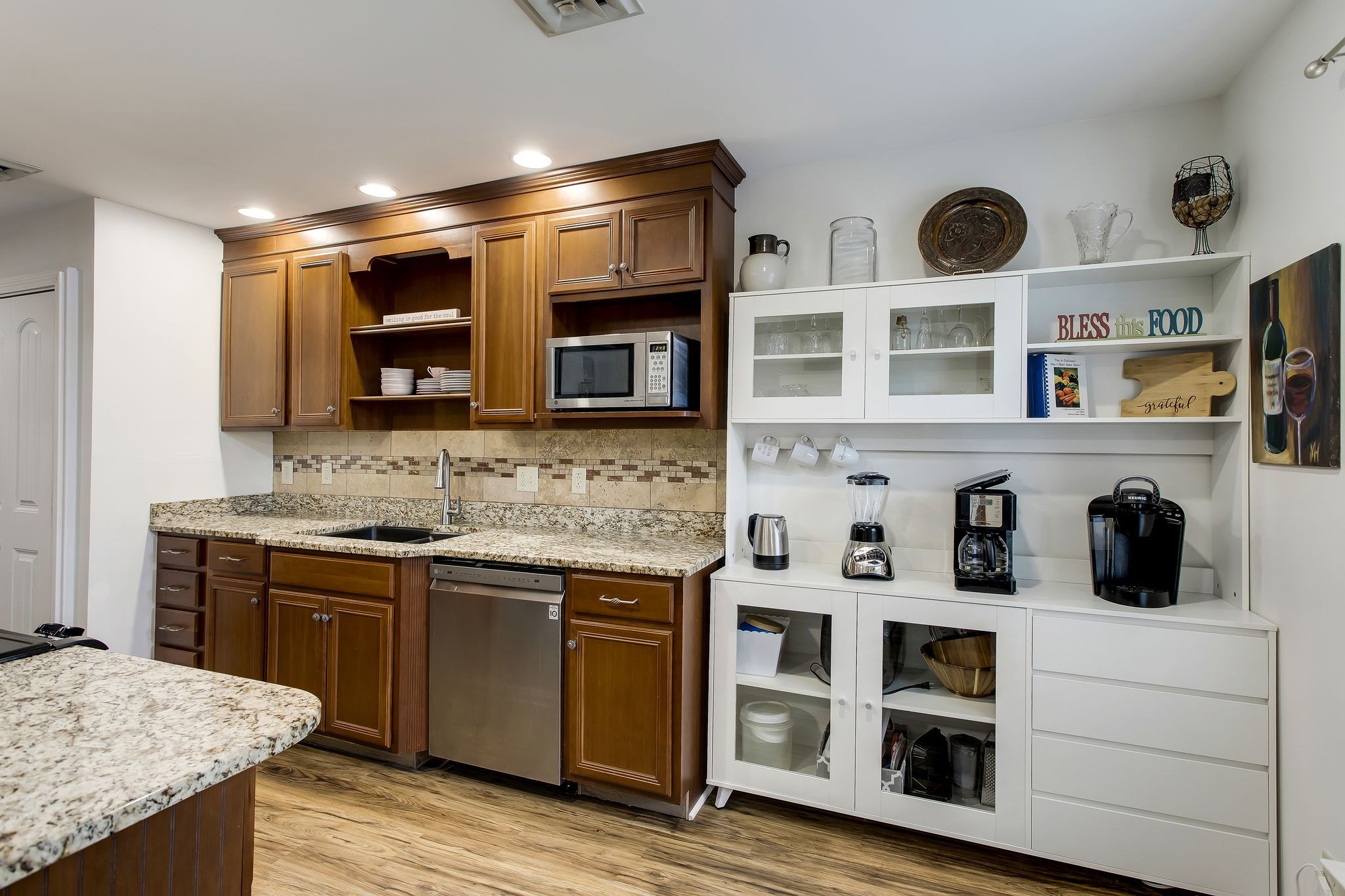 1122 General George Patton Road Nashville, TN 37221 - Photo 10 of 32 a kitchen with stainless steel appliances granite countertop a stove and a microwave