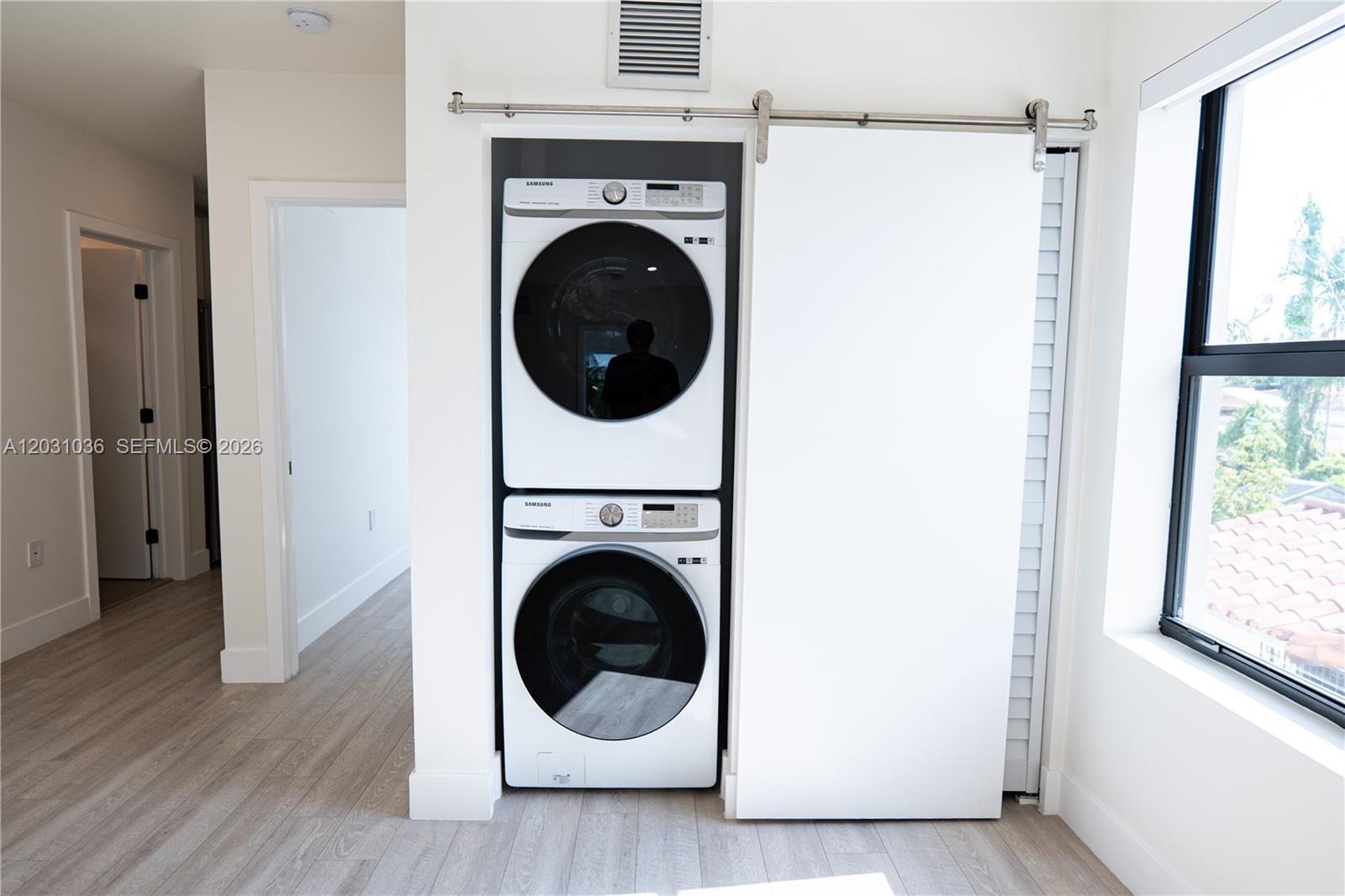 1721 Southwest 13th Street, Unit 4 Miami, FL 33145 - Photo 18 of 24 a view of a hallway with washer and dryer
