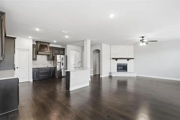 a view of kitchen with refrigerator and window