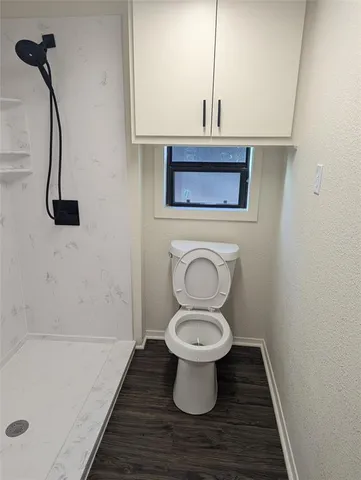a bathroom with a toilet and a sink