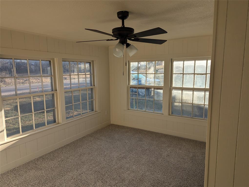 502 East Baker Street Hamilton, TX 76531 - Photo 20 of 37 an empty room with windows and entrance