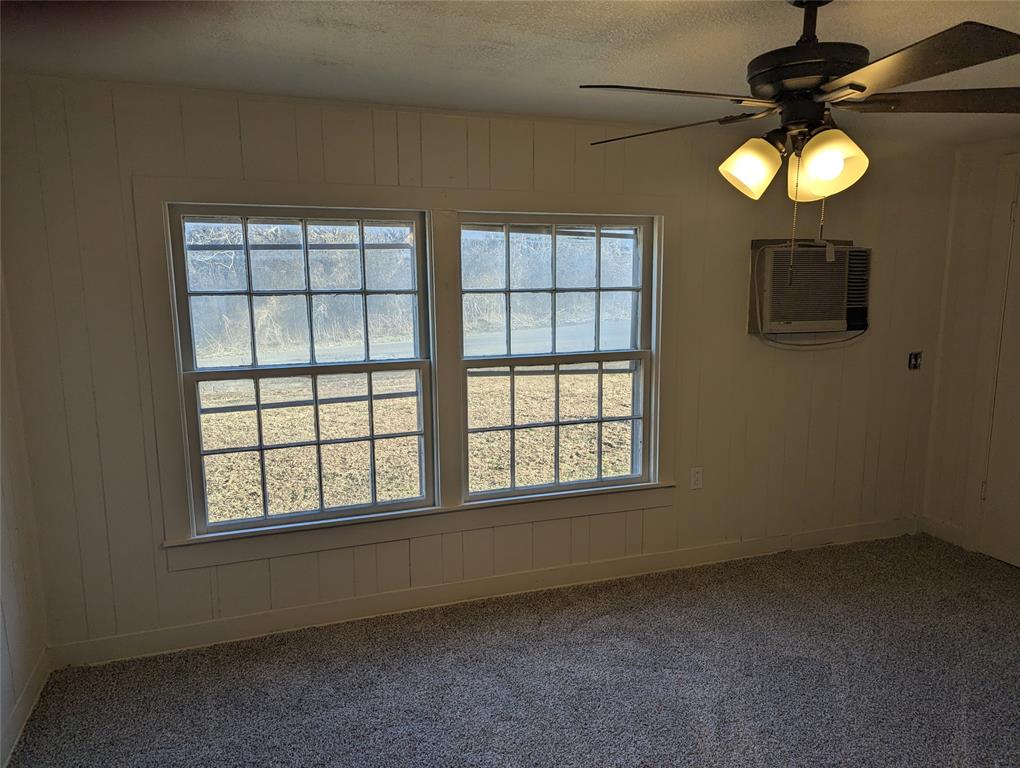 502 East Baker Street Hamilton, TX 76531 - Photo 22 of 37 an empty room with a window