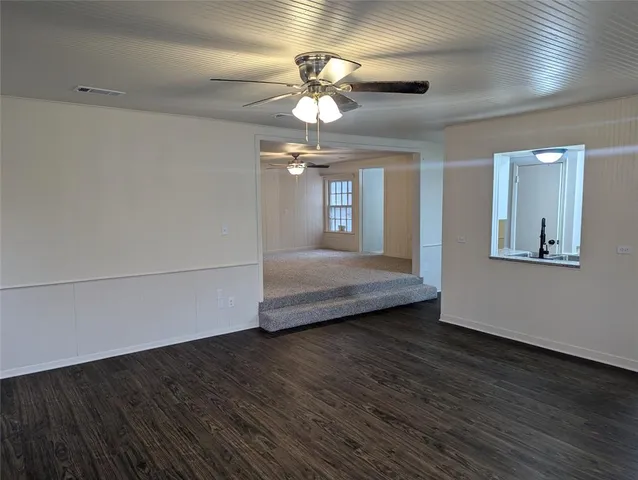 a view of livingroom with hardwood floor and ceiling fan